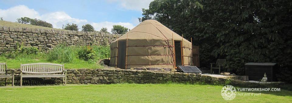 Sand coloured yurt with windoww