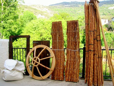 Handcrafted Yurt Workshop components including chestnut wall frames, roof poles, oak crown and door frame