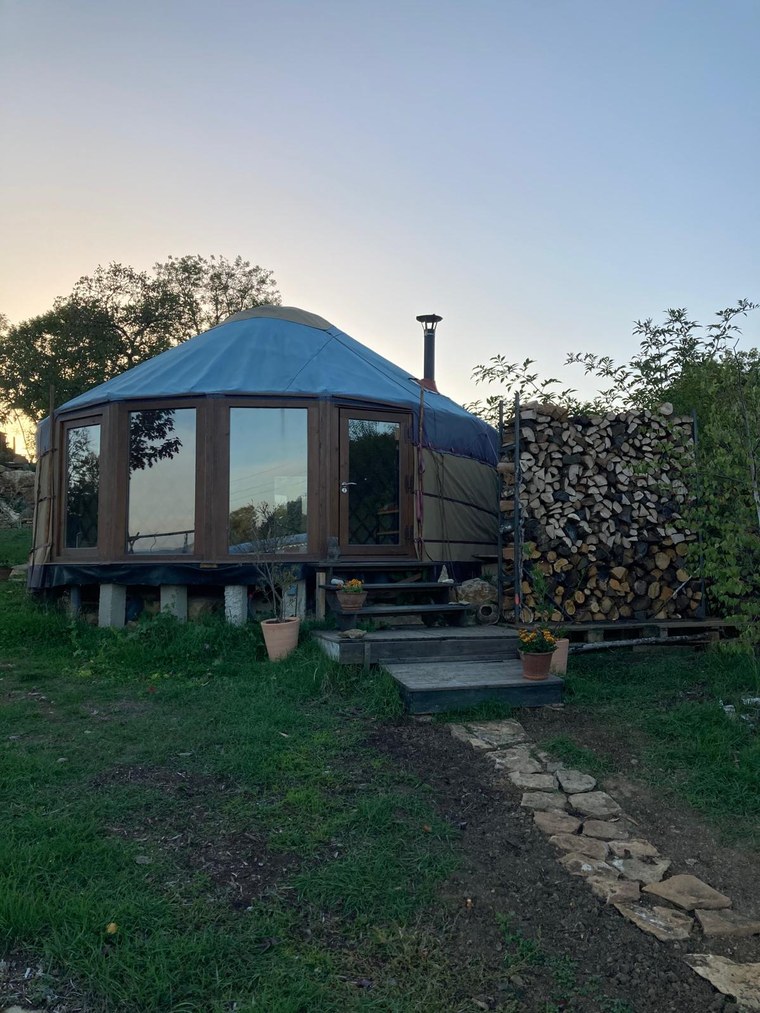 Glass Wall Yurt Workshop yurt at dusk with a wide glazed frontage