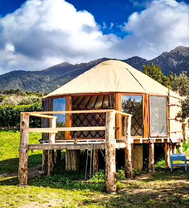 Glass Wall yurt with glazed frontage in a mountain setting