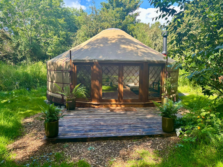 Glass Wall yurt with fitted glass frontage in a woodland setting