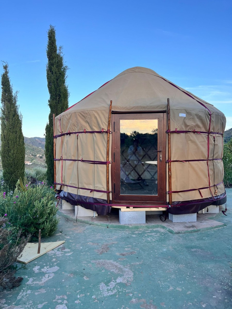 Full-glass wooden door fitted to an insulated Yurt Workshop yurt